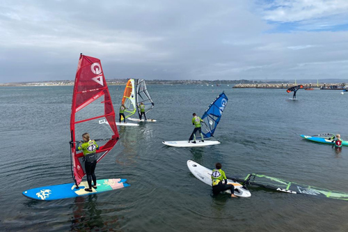 Techno293 UK kids windsurfing club practicing and training in UK waters